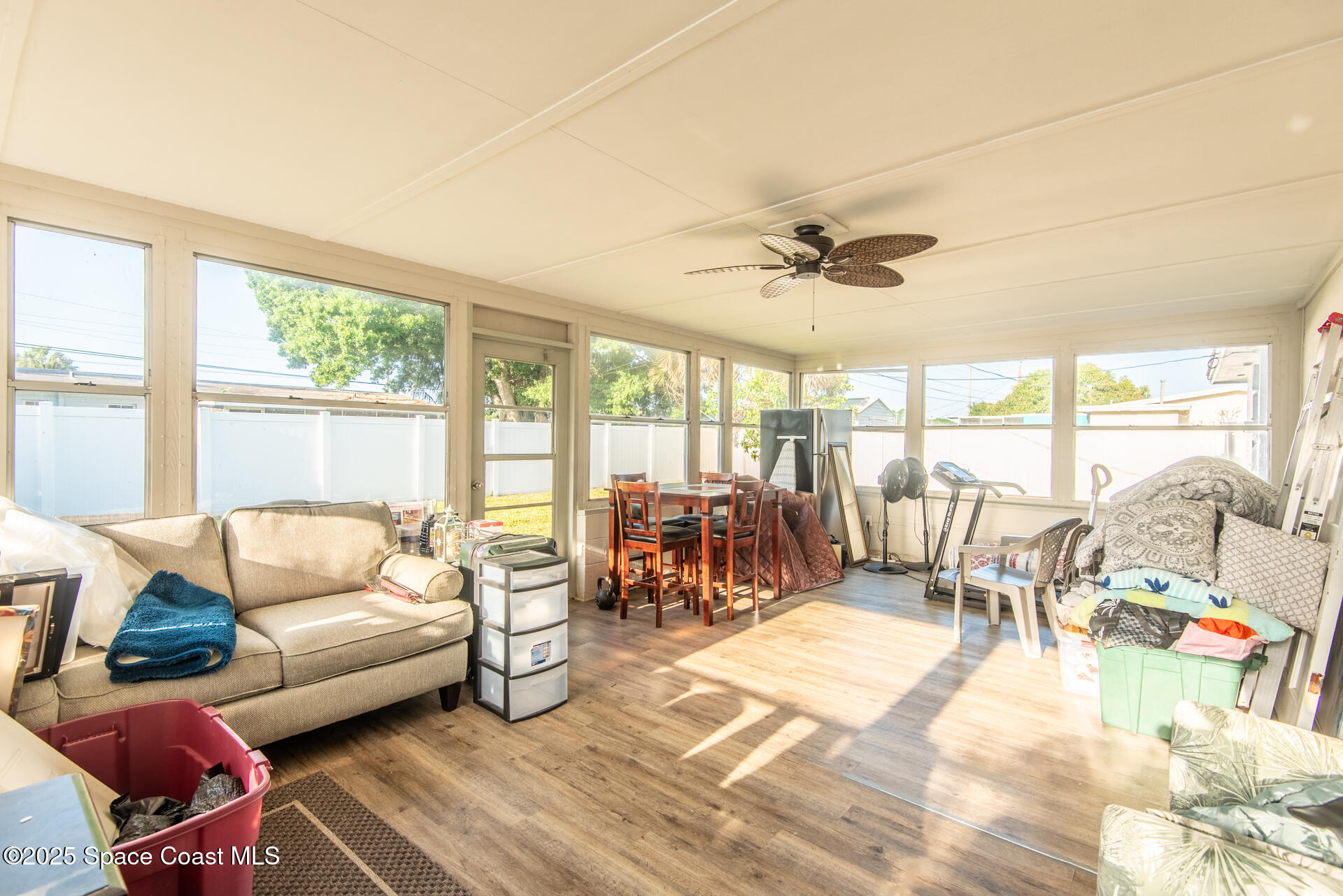 2910 Tropic Road Melbourne, FL 32935 - Photo 13 of 18 a living room with furniture and a large window