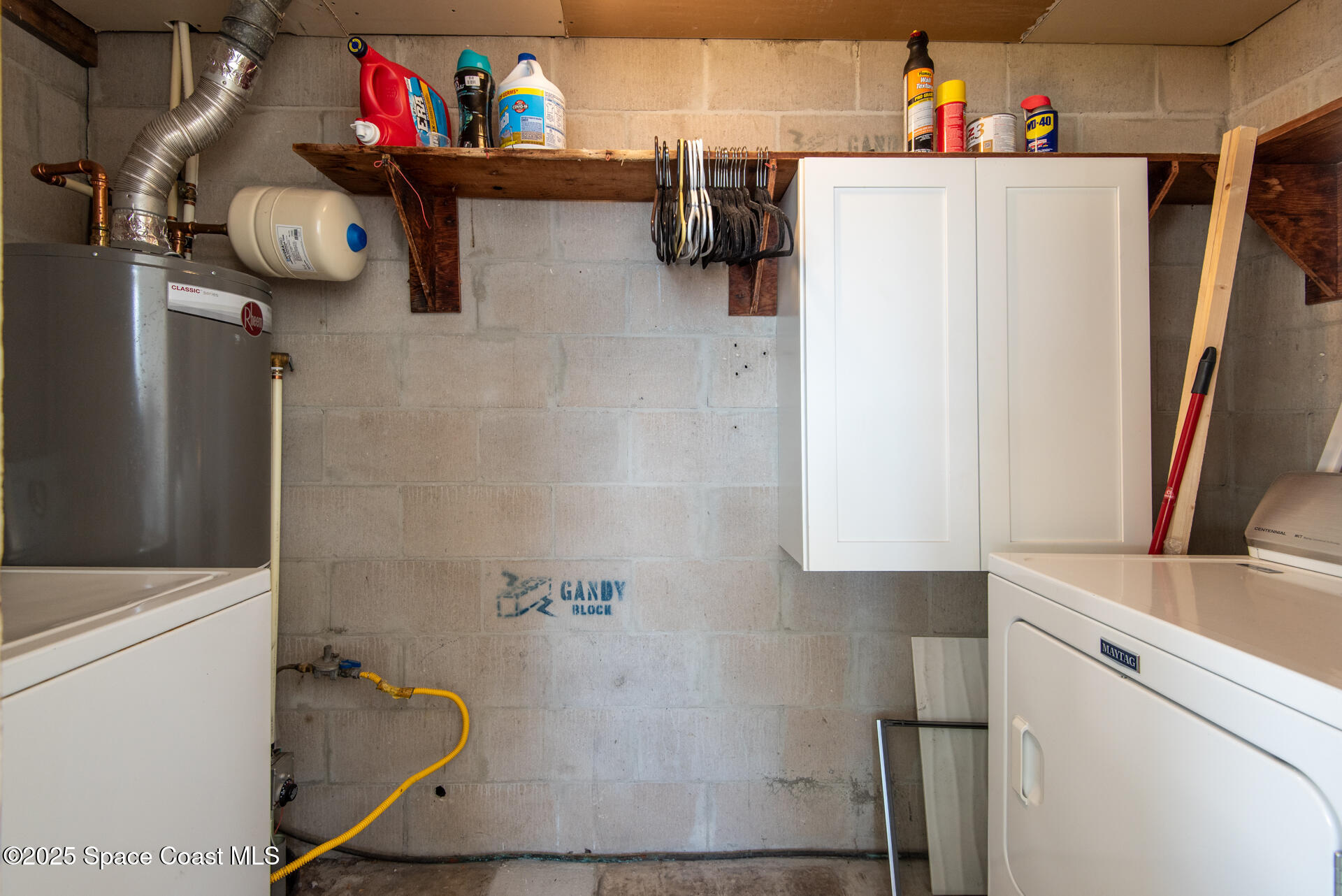 2910 Tropic Road Melbourne, FL 32935 - Photo 15 of 18 a bathroom with a refrigerator and a sink