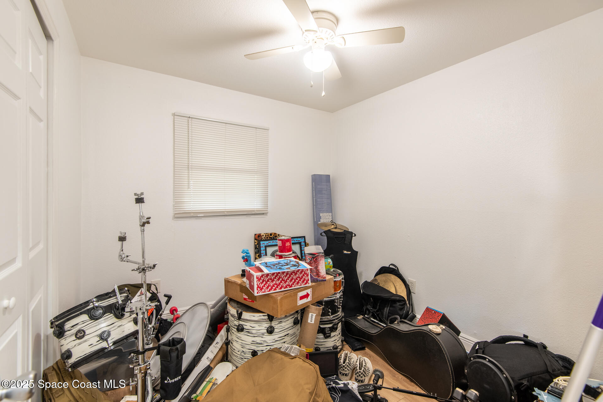 2910 Tropic Road Melbourne, FL 32935 - Photo 9 of 18 a room with furniture and wooden floor