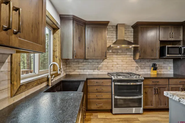 a kitchen with a stove and a sink