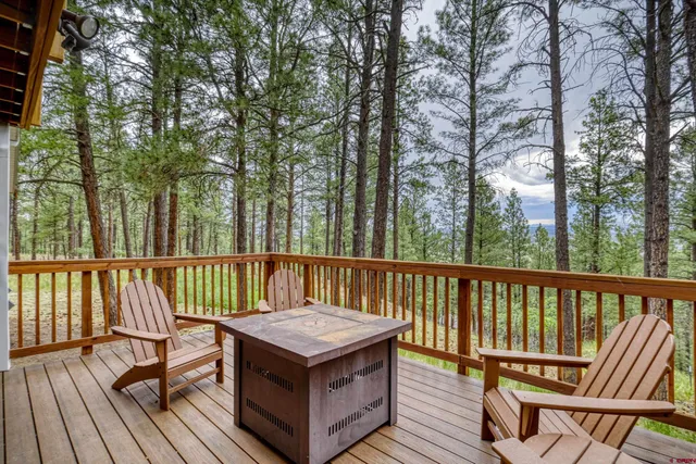 a view of a wooden deck and outdoor seating