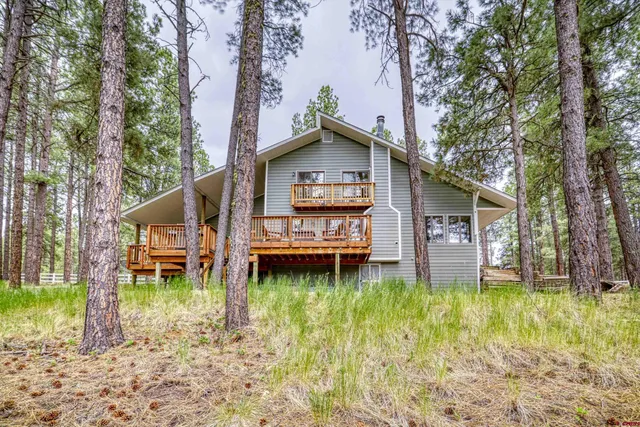 a view of a chairs and table in the balcony