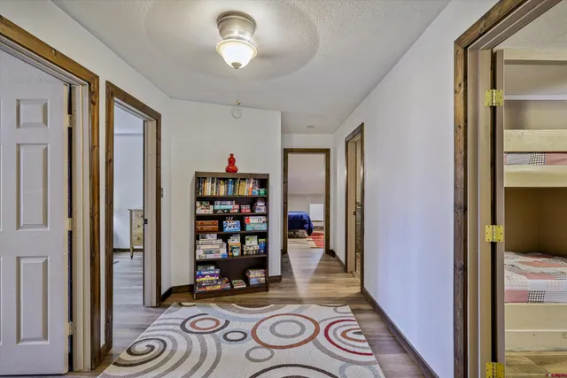 a bedroom with a bed window and a dresser
