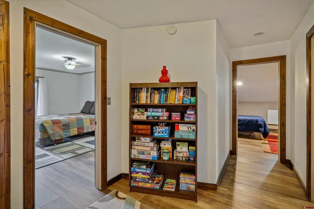 a bedroom with furniture and a wooden floor