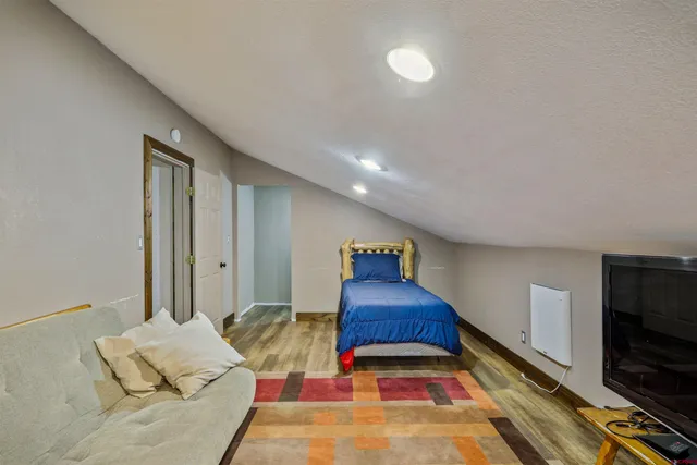 a view of a livingroom with furniture and entryway