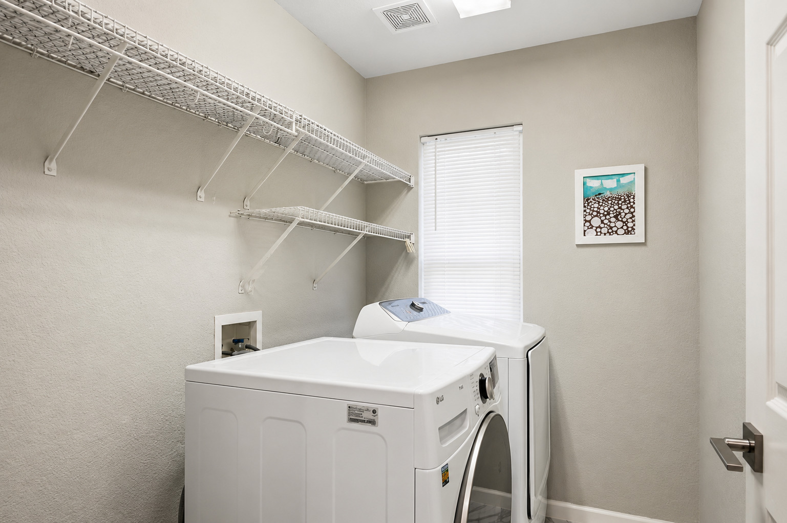 1921 Rutherford Drive Leander, TX 78641 - Photo 21 of 29 Functional workspace features built-in wire shelving and a window that provides natural light. Virtually Staged.