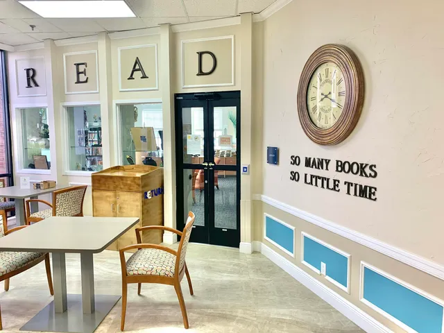 a view of a kitchen with a table and chairs
