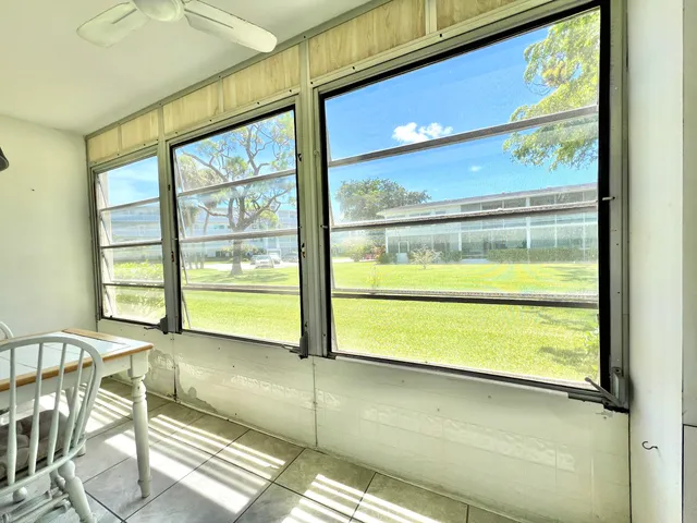 a view of a room with a large window