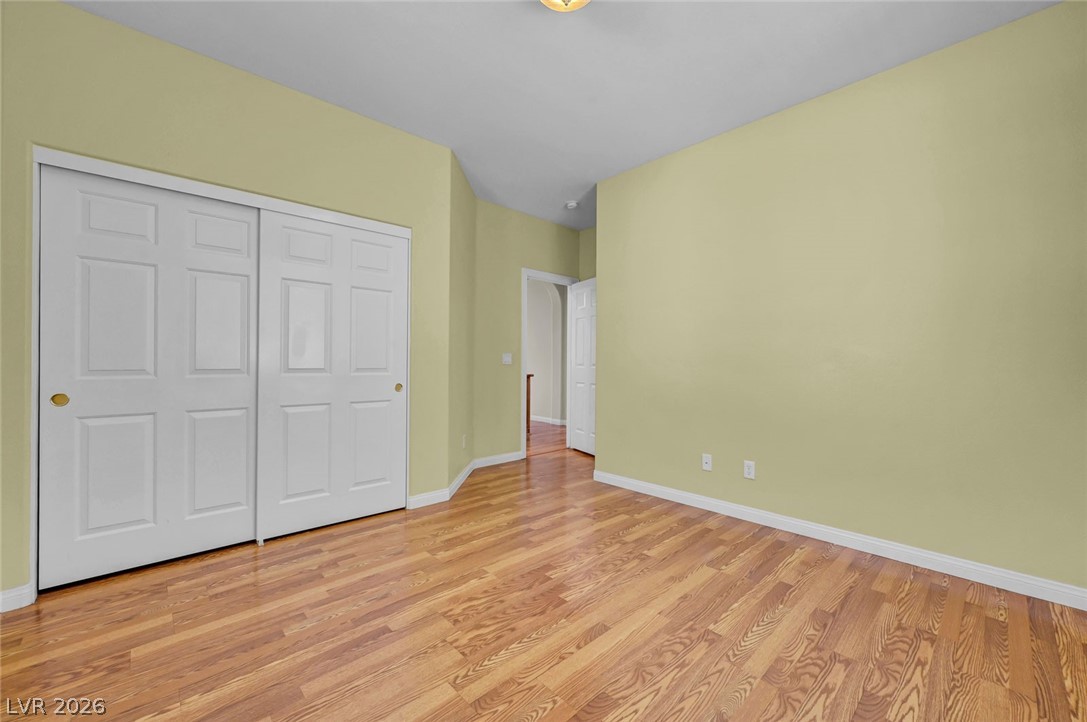977 Sparkling Light Street Henderson, NV 89052 - Photo 52 of 75 This inviting room features warm wood flooring and convenient closet access.