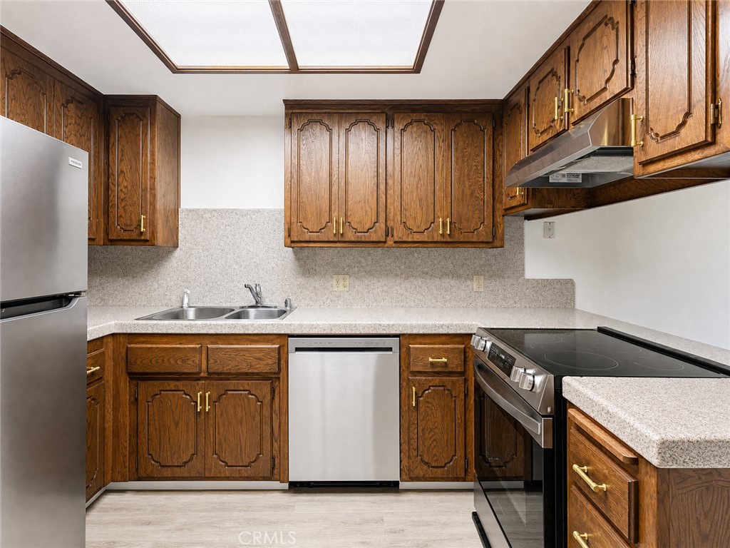 2180 Bellevue Road Atwater, CA 95301 - Photo 11 of 31 a kitchen with stainless steel appliances granite countertop a sink and cabinets