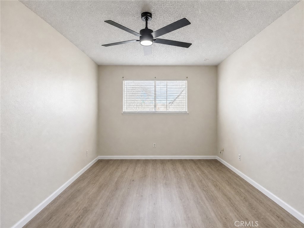2180 Bellevue Road Atwater, CA 95301 - Photo 20 of 31 an empty room with a window and a fan