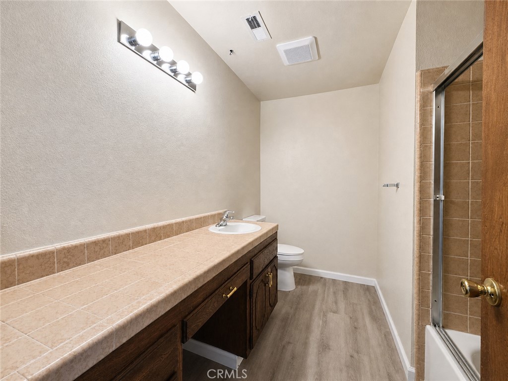 2180 Bellevue Road Atwater, CA 95301 - Photo 24 of 31 a view of a bathroom with a sink and a window