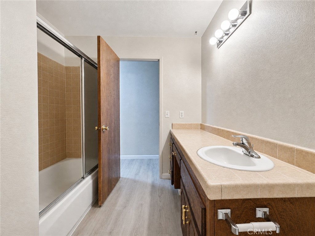 2180 Bellevue Road Atwater, CA 95301 - Photo 26 of 31 a bathroom with a sink a mirror and a shower
