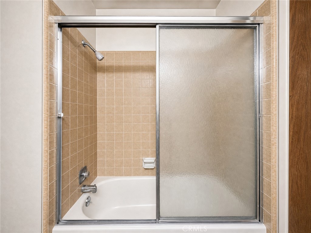 2180 Bellevue Road Atwater, CA 95301 - Photo 27 of 31 a bathroom with a glass shower door