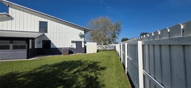 a front view of house with yard and outdoor seating