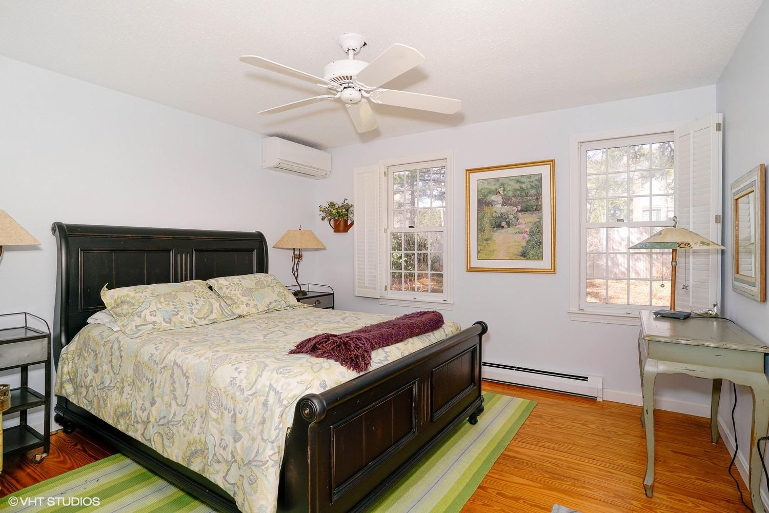 105 Cole Road Eastham, MA 02642 - Photo 14 of 30 a bedroom with a bed and wooden floor
