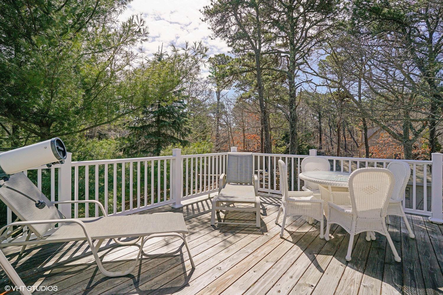 105 Cole Road Eastham, MA 02642 - Photo 18 of 30 a view of a patio on the deck