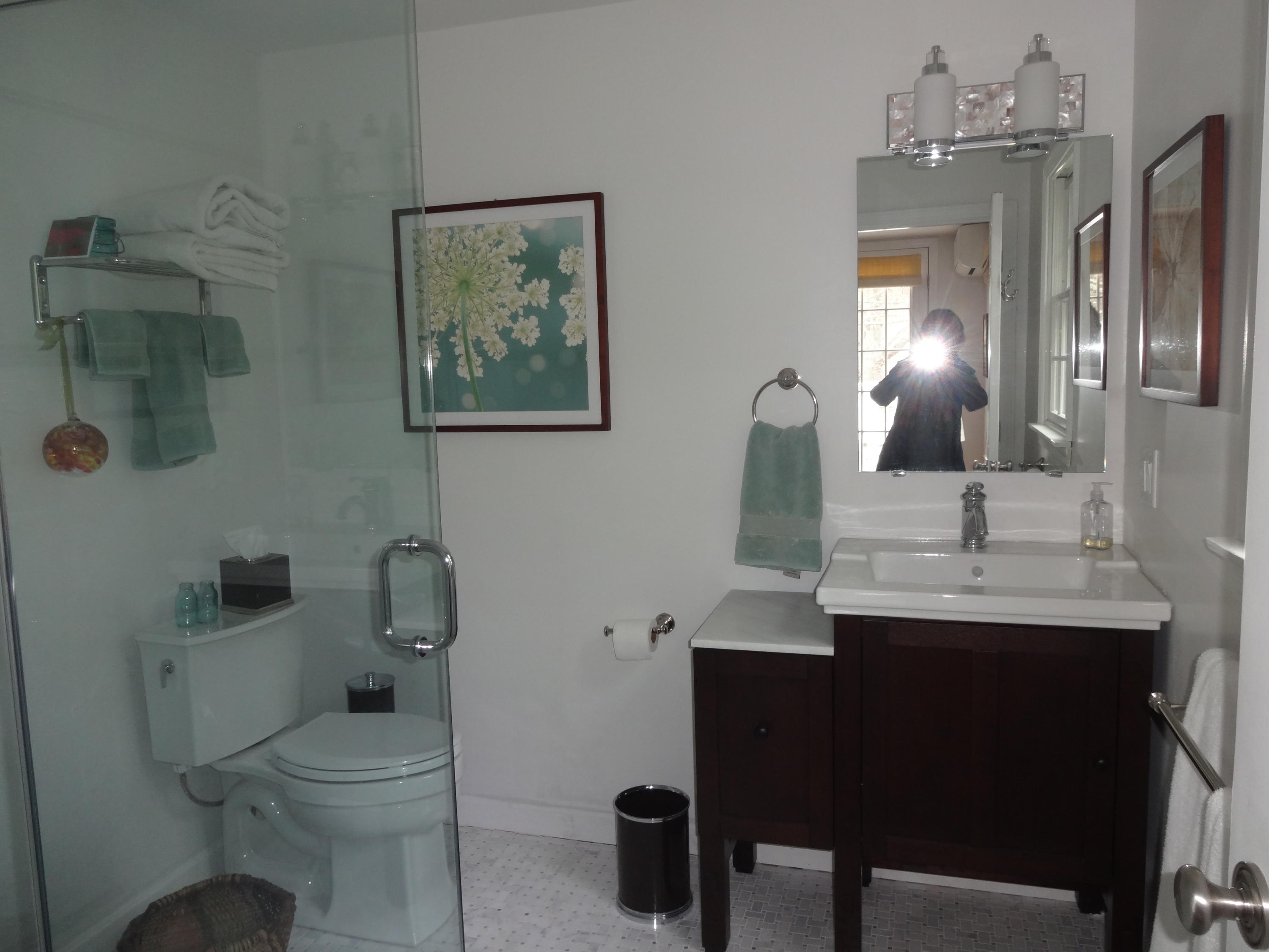 105 Cole Road Eastham, MA 02642 - Photo 19 of 30 a bathroom with a toilet a sink and mirror