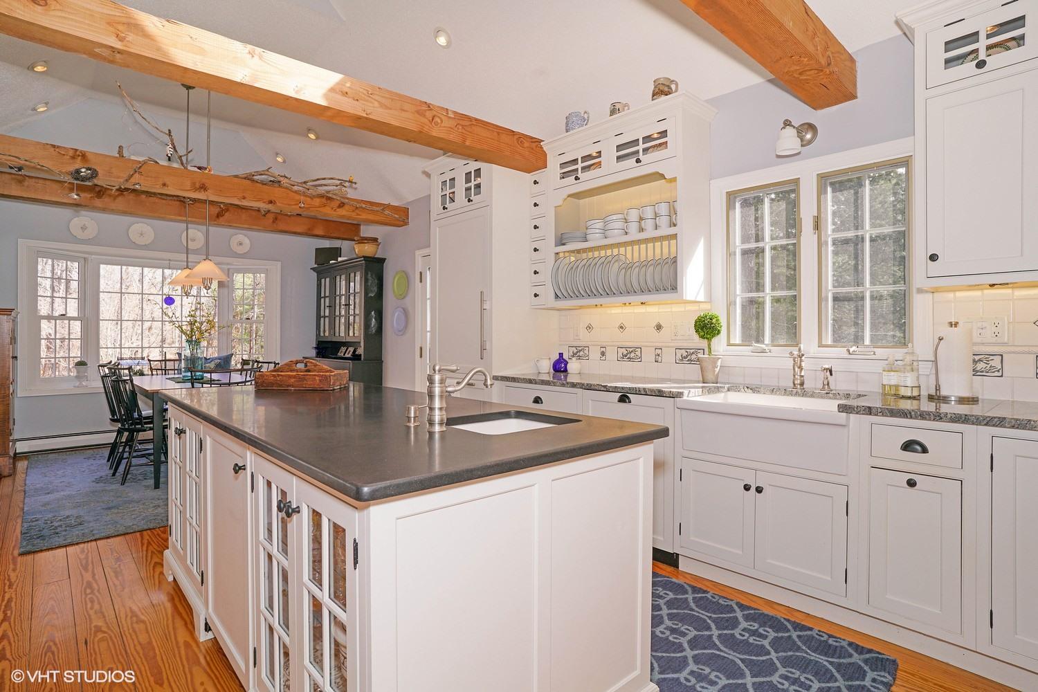 105 Cole Road Eastham, MA 02642 - Photo 2 of 30 a kitchen with sink stove and cabinets