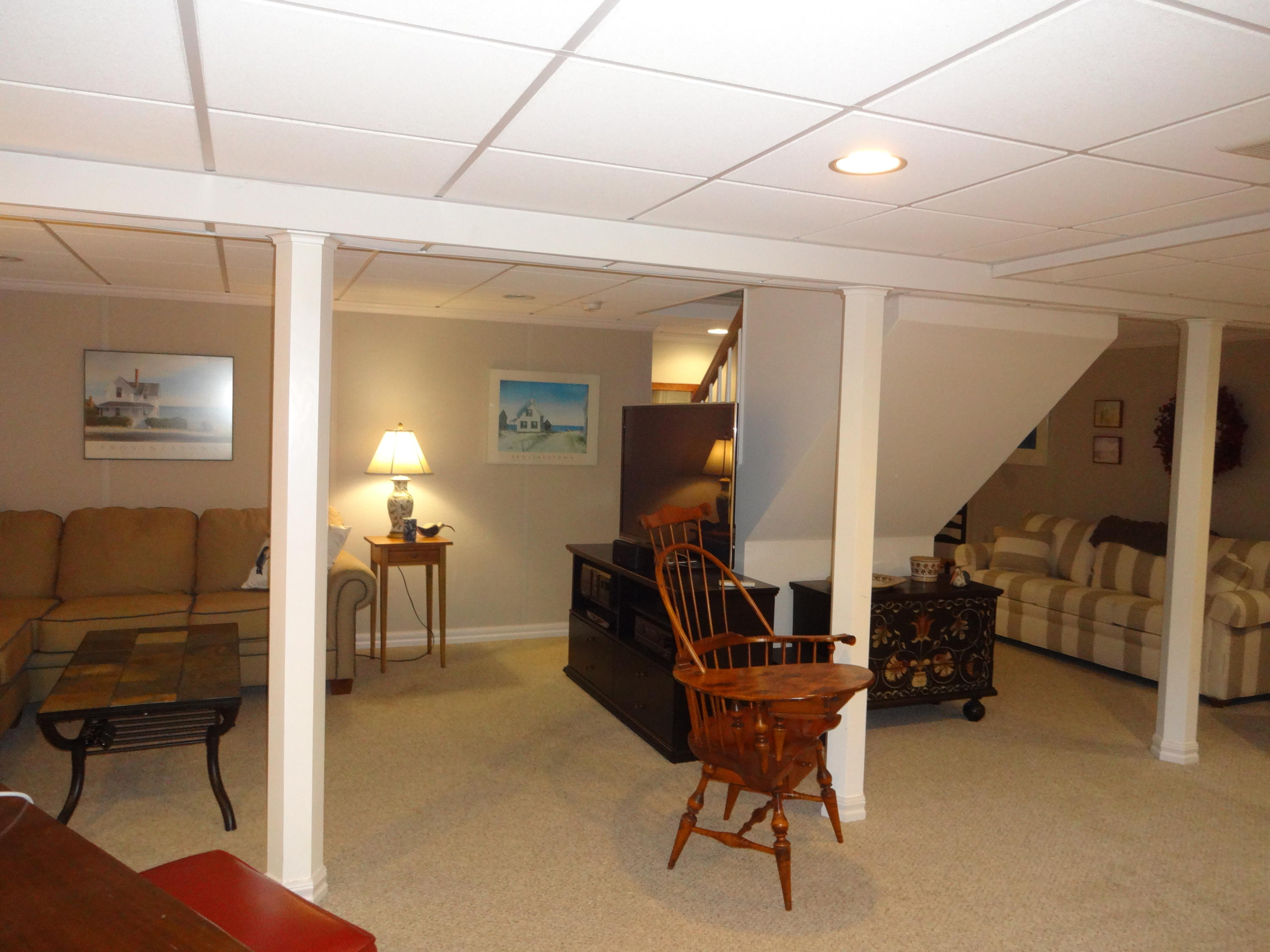 105 Cole Road Eastham, MA 02642 - Photo 21 of 30 a living room with furniture and a chair