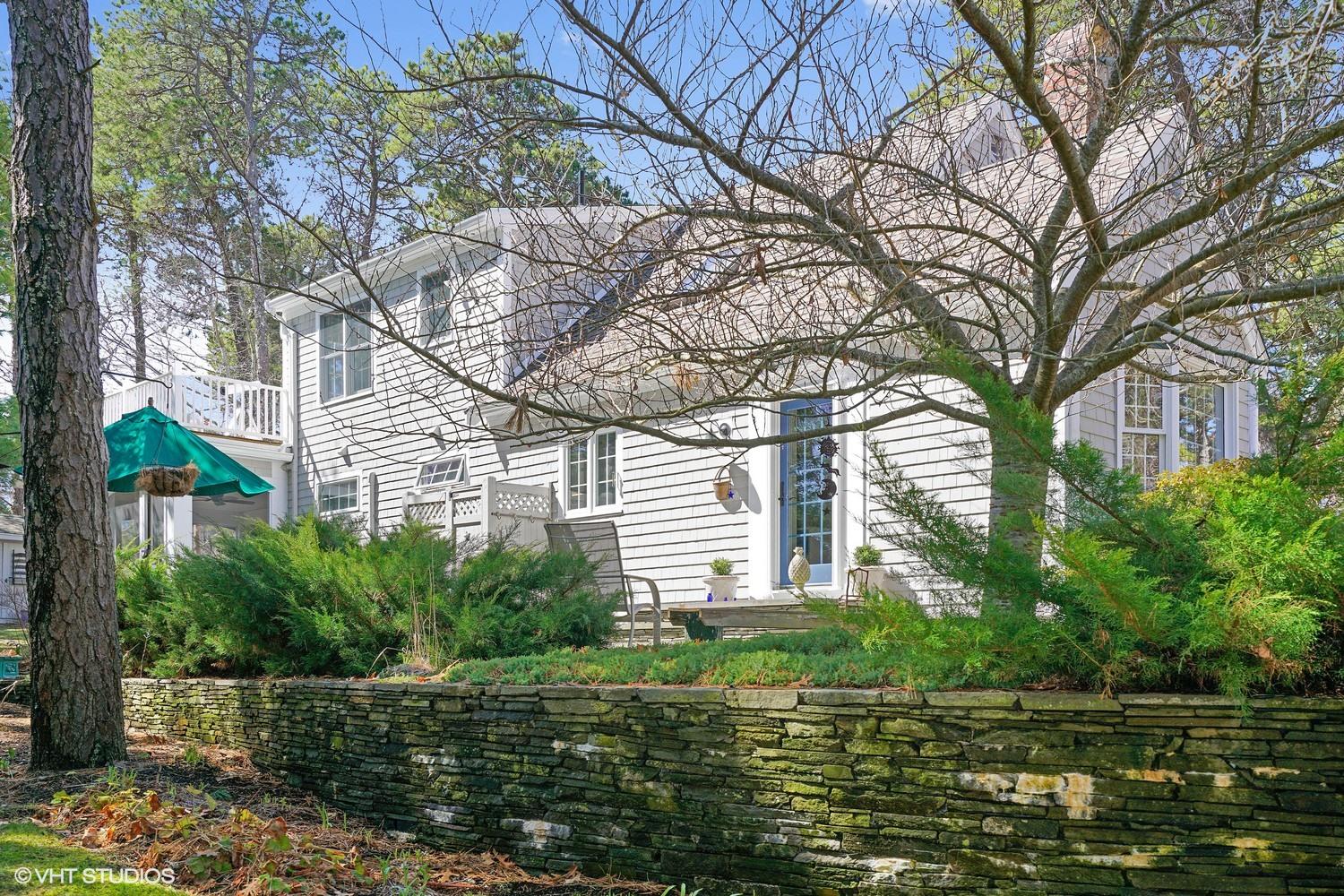 105 Cole Road Eastham, MA 02642 - Photo 27 of 30 a backyard of a house with lots of green space