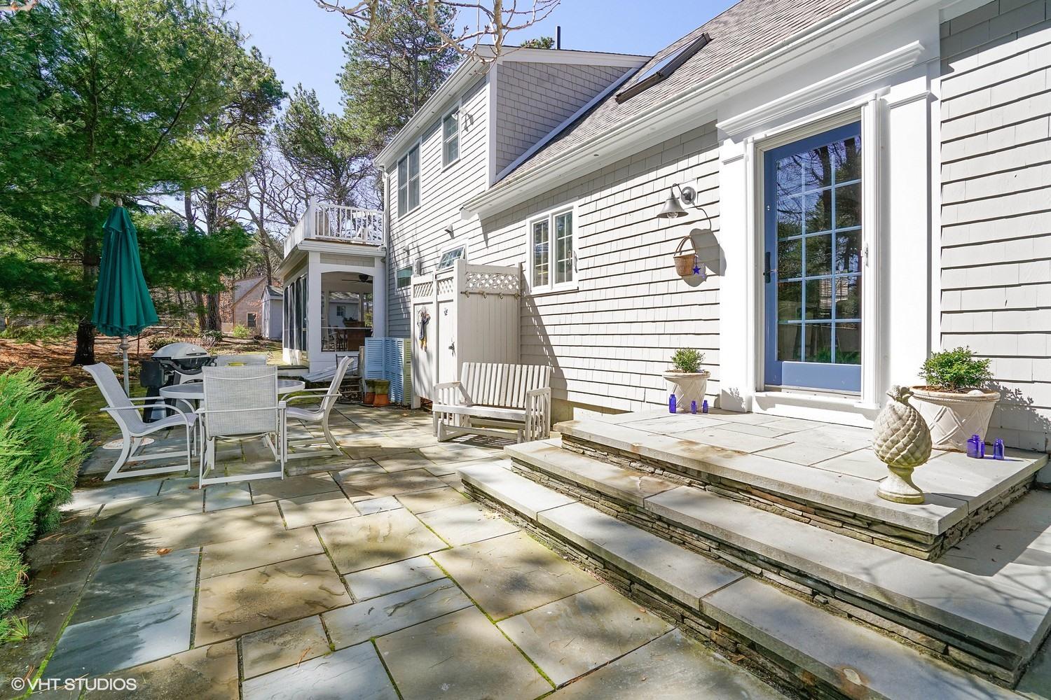 105 Cole Road Eastham, MA 02642 - Photo 28 of 30 a view of a house with backyard and sitting area