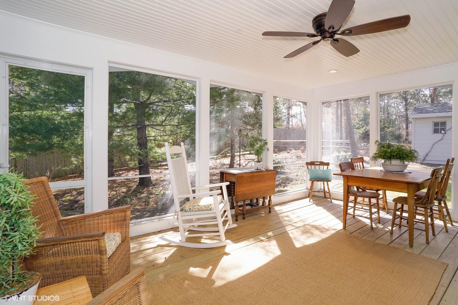 105 Cole Road Eastham, MA 02642 - Photo 10 of 30 a living room with furniture a ceiling fan and a large window