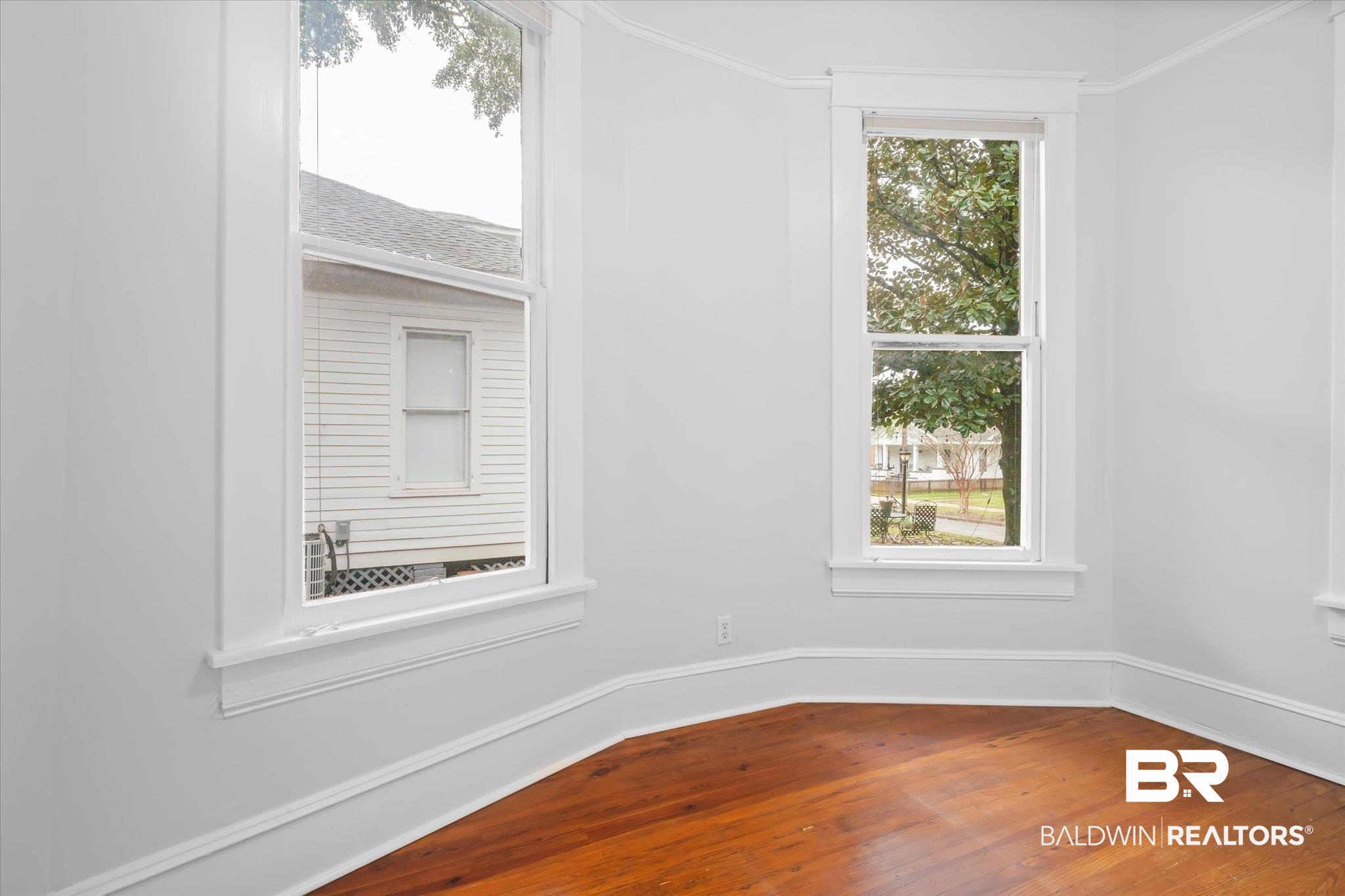 14 South Monterey Street Mobile, AL 36604 - Photo 29 of 41 Spare room with hardwood / wood-style flooring and crown molding