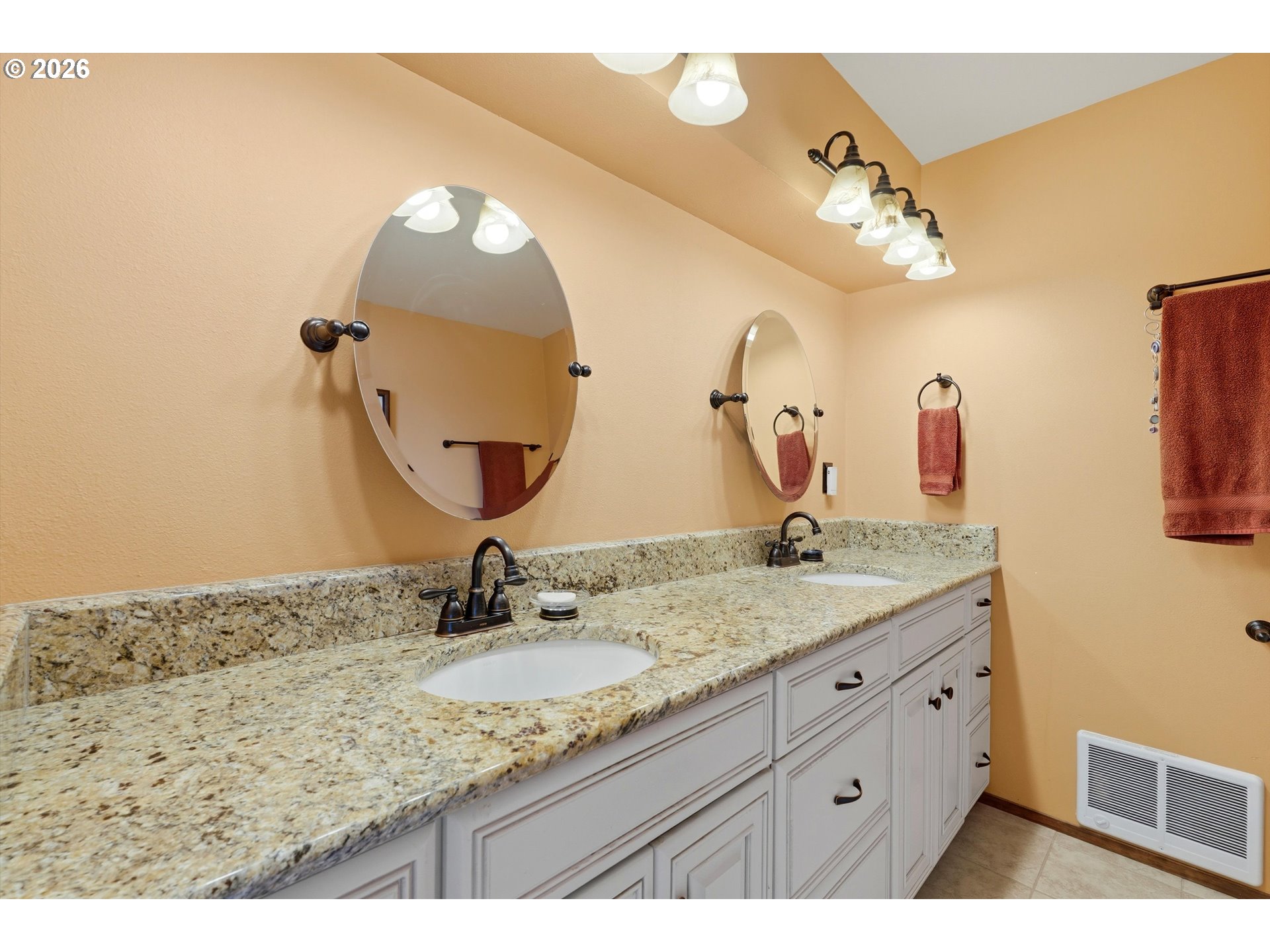 3355 Otter Crest Loop Depoe Bay, OR 97341 - Photo 15 of 35 a bathroom with a double vanity sink and a mirror