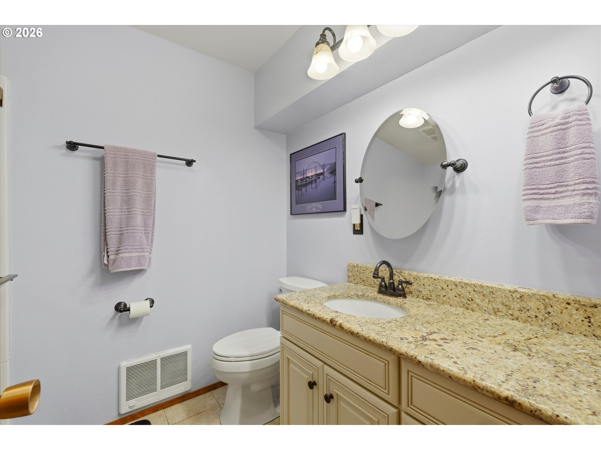 3355 Otter Crest Loop Depoe Bay, OR 97341 - Photo 16 of 35 a bathroom with a granite countertop toilet sink and mirror
