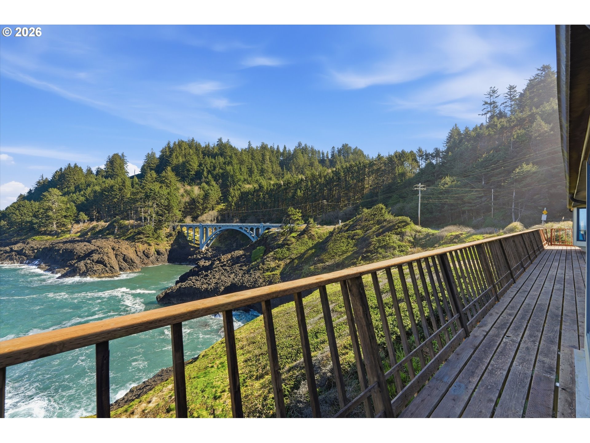 3355 Otter Crest Loop Depoe Bay, OR 97341 - Photo 17 of 35 a view of a balcony with wooden floor and city view