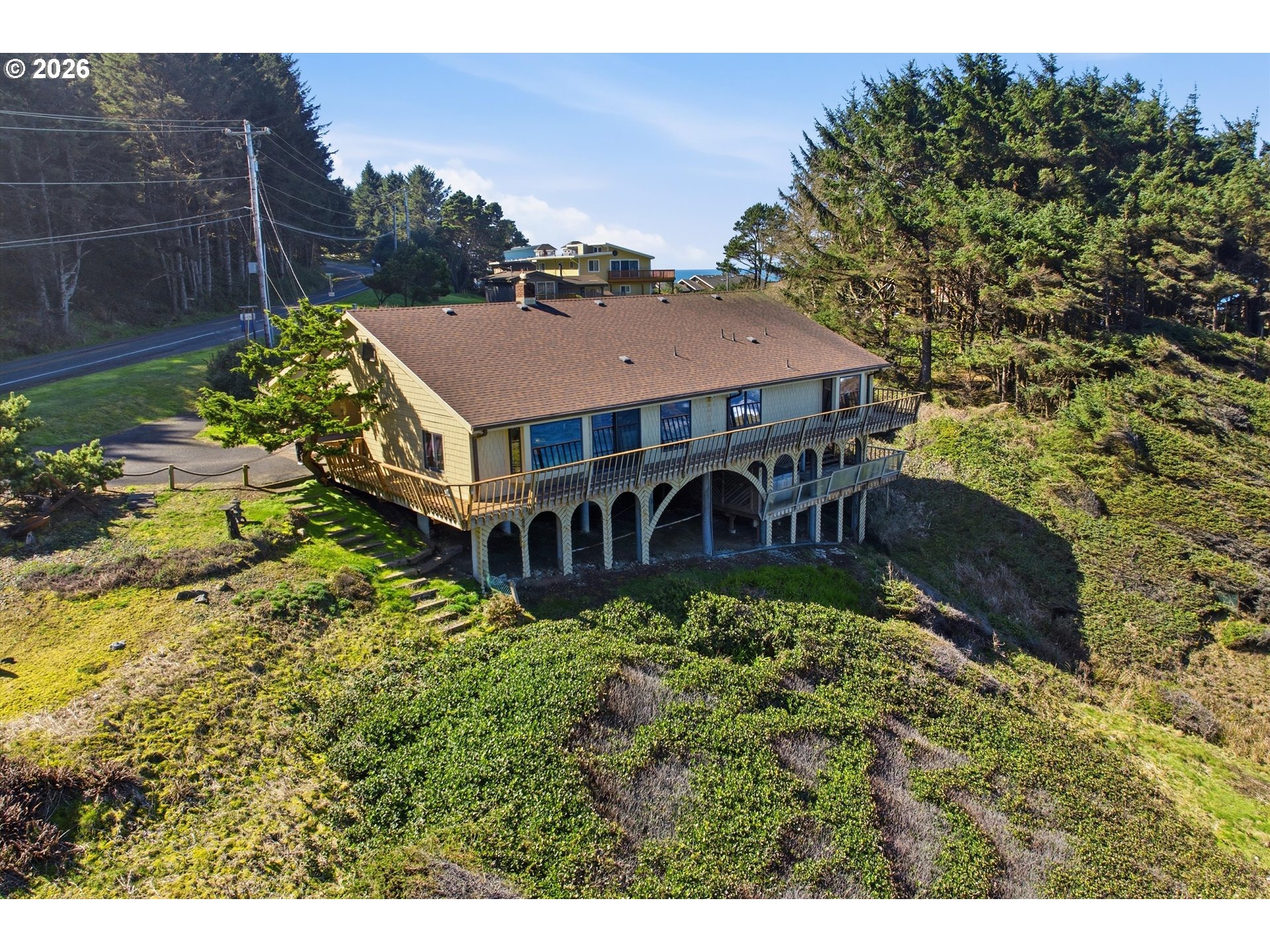 3355 Otter Crest Loop Depoe Bay, OR 97341 - Photo 23 of 35 a aerial view of a house with a yard and potted plants