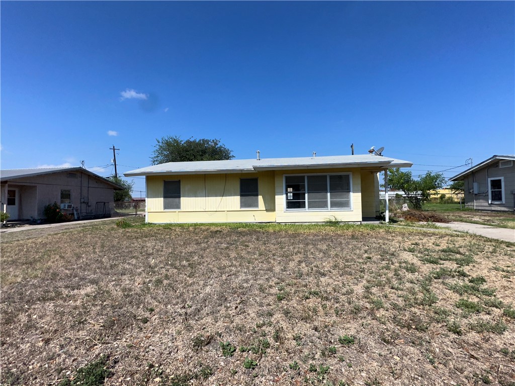 317 Redwood Drive Mathis, TX 78368 - Photo 2 of 26 a front view of a house with a garden