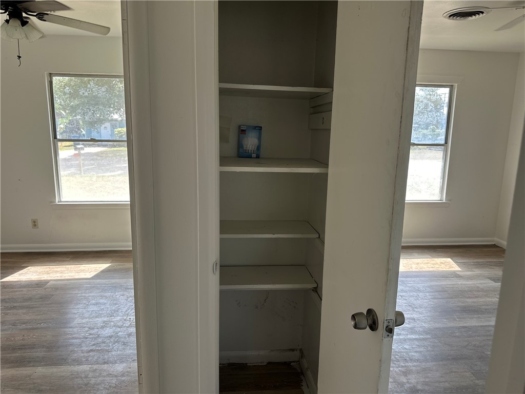 317 Redwood Drive Mathis, TX 78368 - Photo 21 of 26 a view of a hallway with closet and window