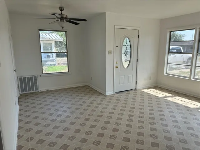 a view of an empty room and window
