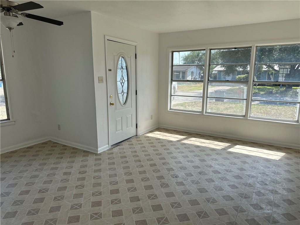 317 Redwood Drive Mathis, TX 78368 - Photo 8 of 26 an empty room with windows