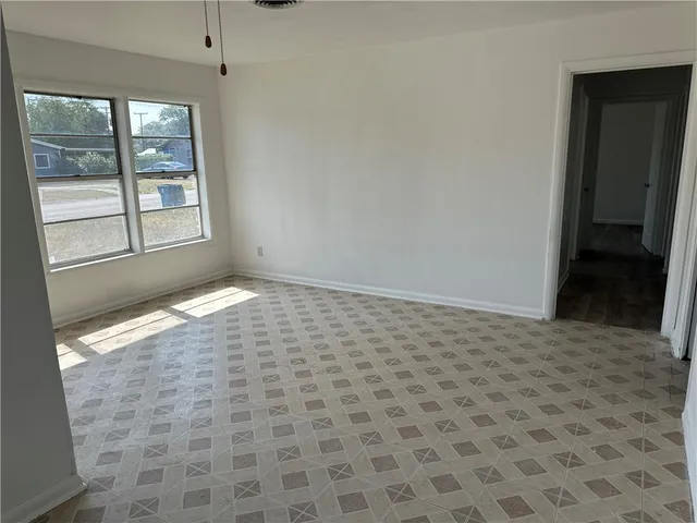 a view of an empty room and window