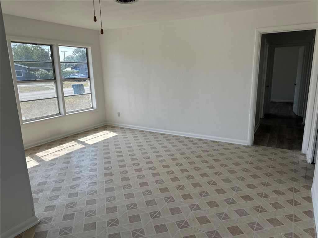 317 Redwood Drive Mathis, TX 78368 - Photo 9 of 26 a view of an empty room and window