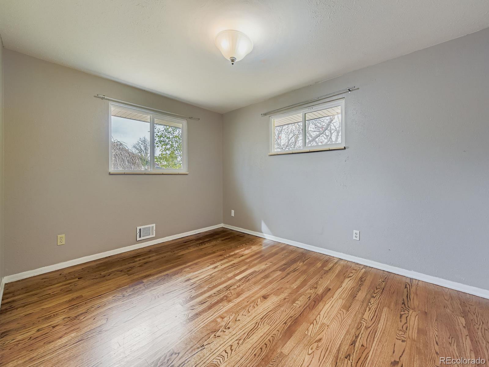 6536 South Kit Carson Street Centennial, CO 80121 - Photo 8 of 32 a view of empty room with wooden floor