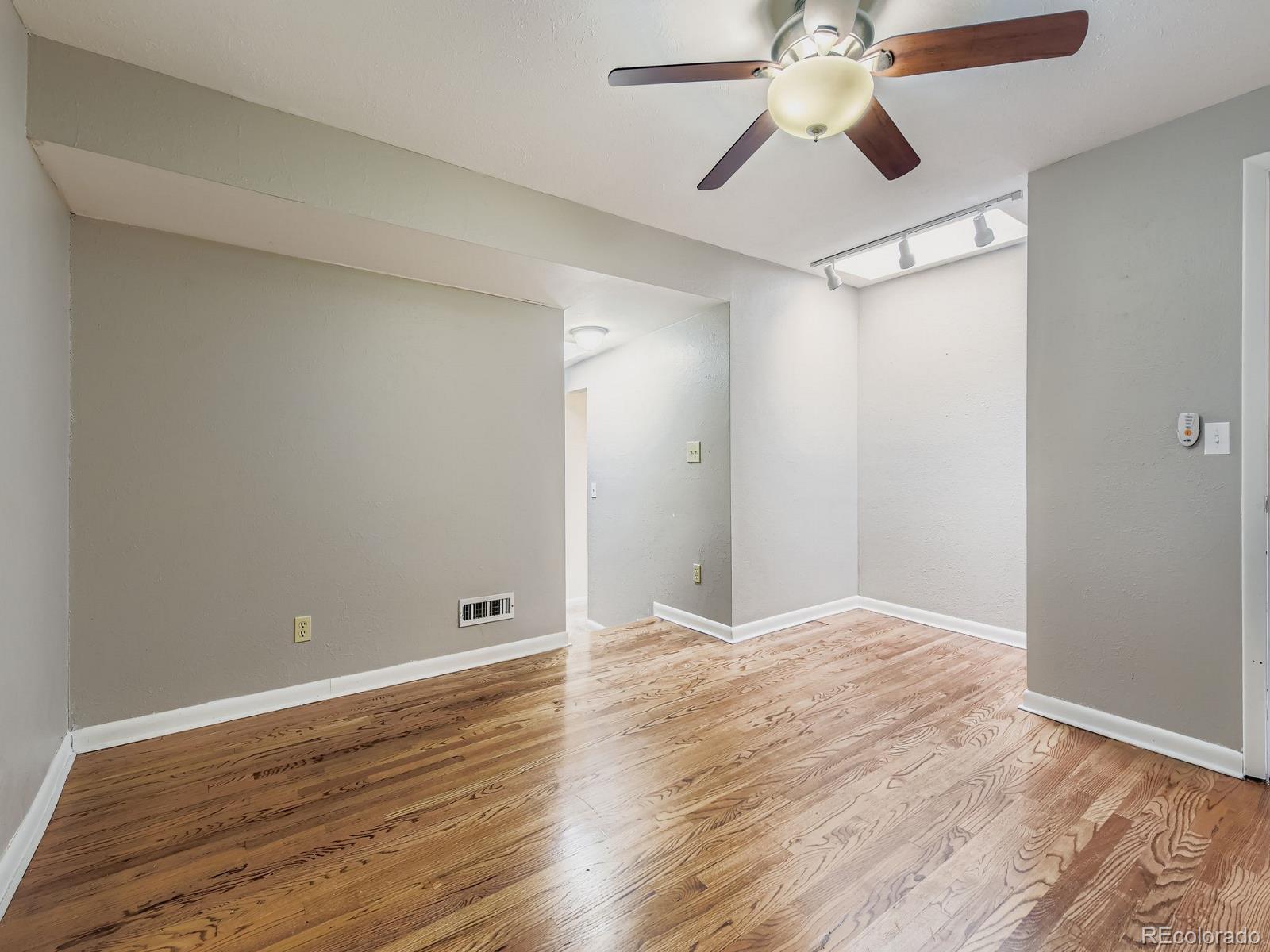 6536 South Kit Carson Street Centennial, CO 80121 - Photo 9 of 32 a view of empty room with wooden floor
