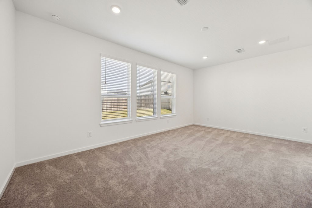 8922 Riverton Rdg Road Cypress, TX 77433 - Photo 12 of 25 an empty room with a window