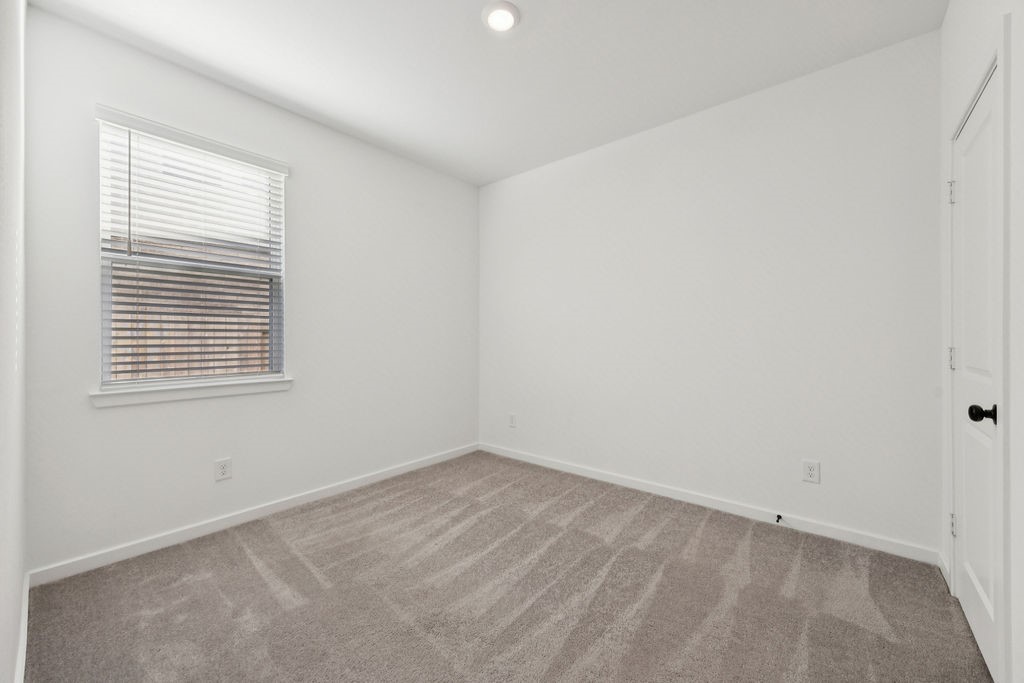 8922 Riverton Rdg Road Cypress, TX 77433 - Photo 15 of 25 an empty room with a window