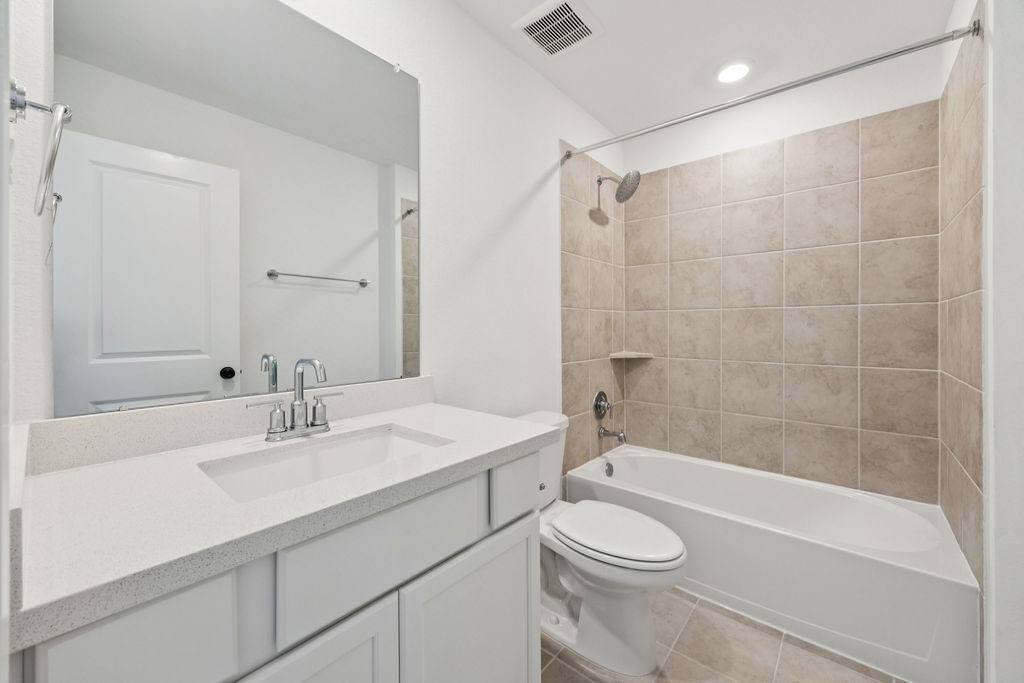 8922 Riverton Rdg Road Cypress, TX 77433 - Photo 20 of 25 a bathroom with a sink toilet and shower