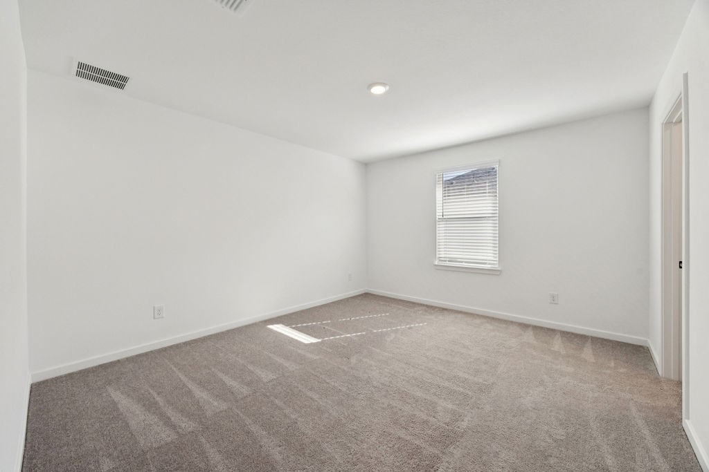 8922 Riverton Rdg Road Cypress, TX 77433 - Photo 21 of 25 an empty room with a window