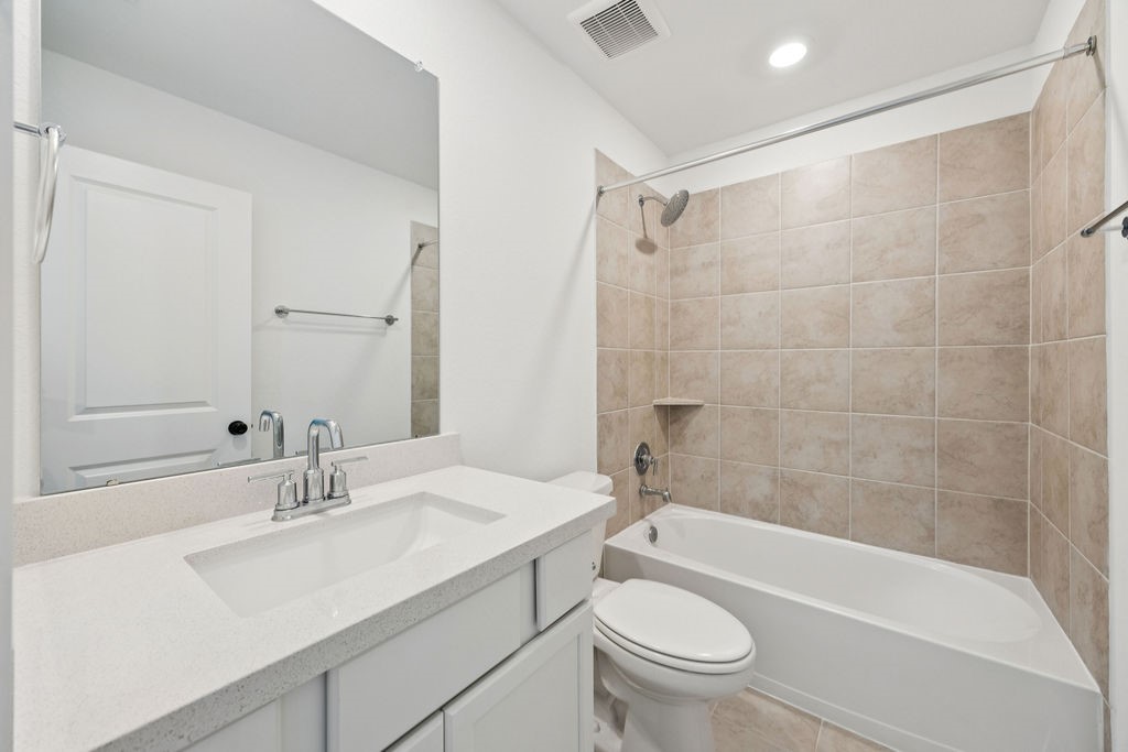 8922 Riverton Rdg Road Cypress, TX 77433 - Photo 22 of 25 a bathroom with a sink a toilet and shower
