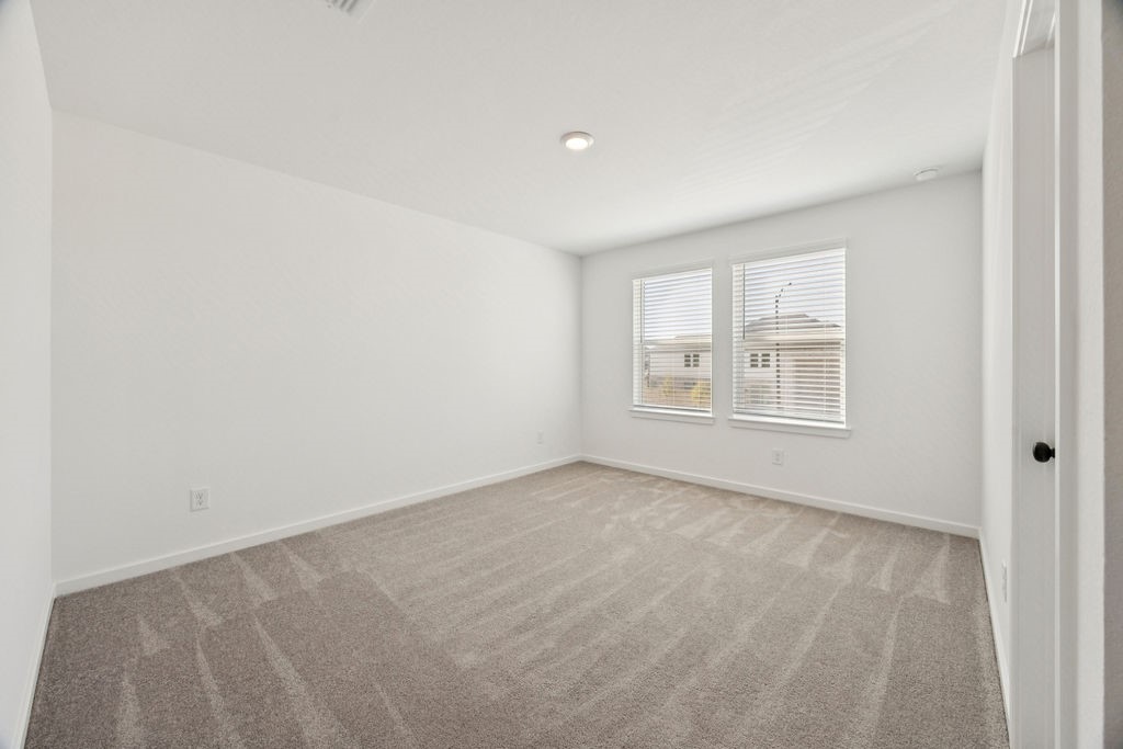 8922 Riverton Rdg Road Cypress, TX 77433 - Photo 23 of 25 an empty room with windows