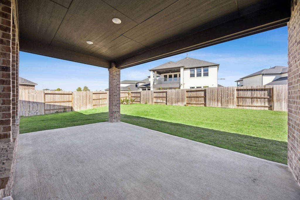 8922 Riverton Rdg Road Cypress, TX 77433 - Photo 24 of 25 a view of a porch with two chairs and a big yard