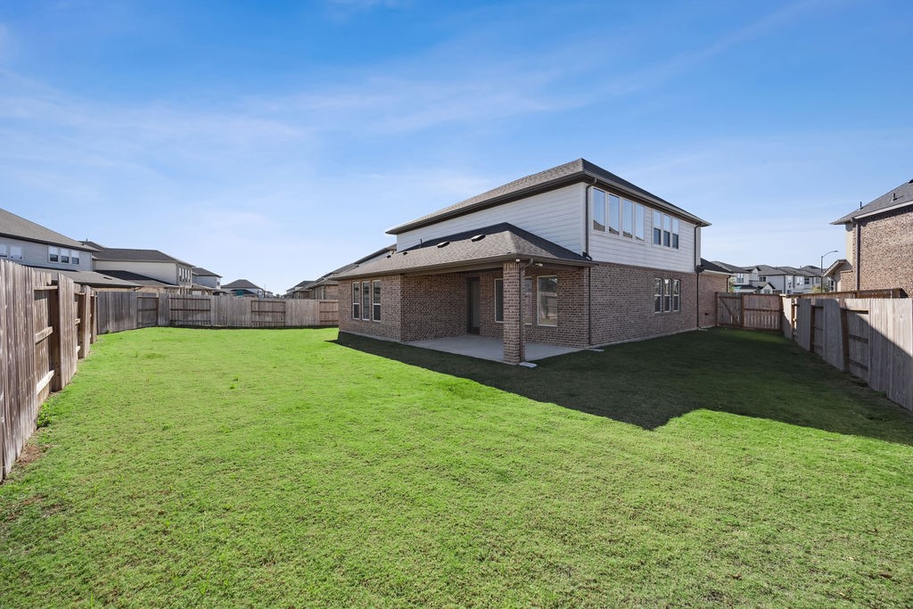 8922 Riverton Rdg Road Cypress, TX 77433 - Photo 25 of 25 a front view of a house with garden