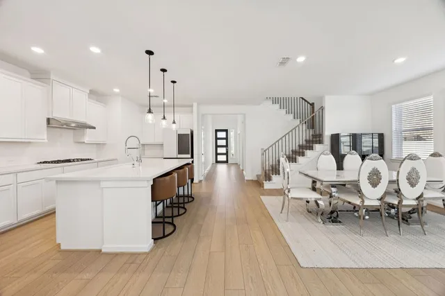 a large kitchen with lots of counter space and windows