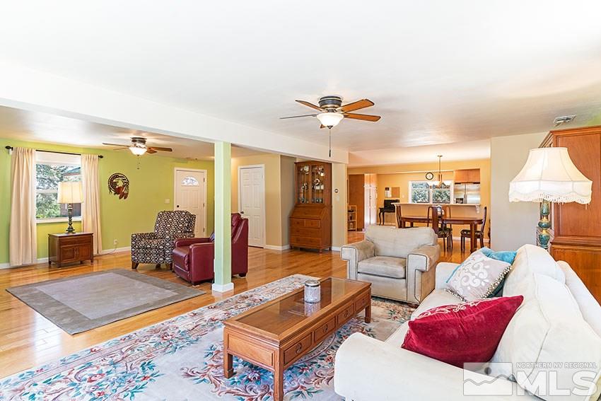 2141 Cartwright Road Reno, NV 89521 - Photo 4 of 23 a living room with furniture a rug and a lamp